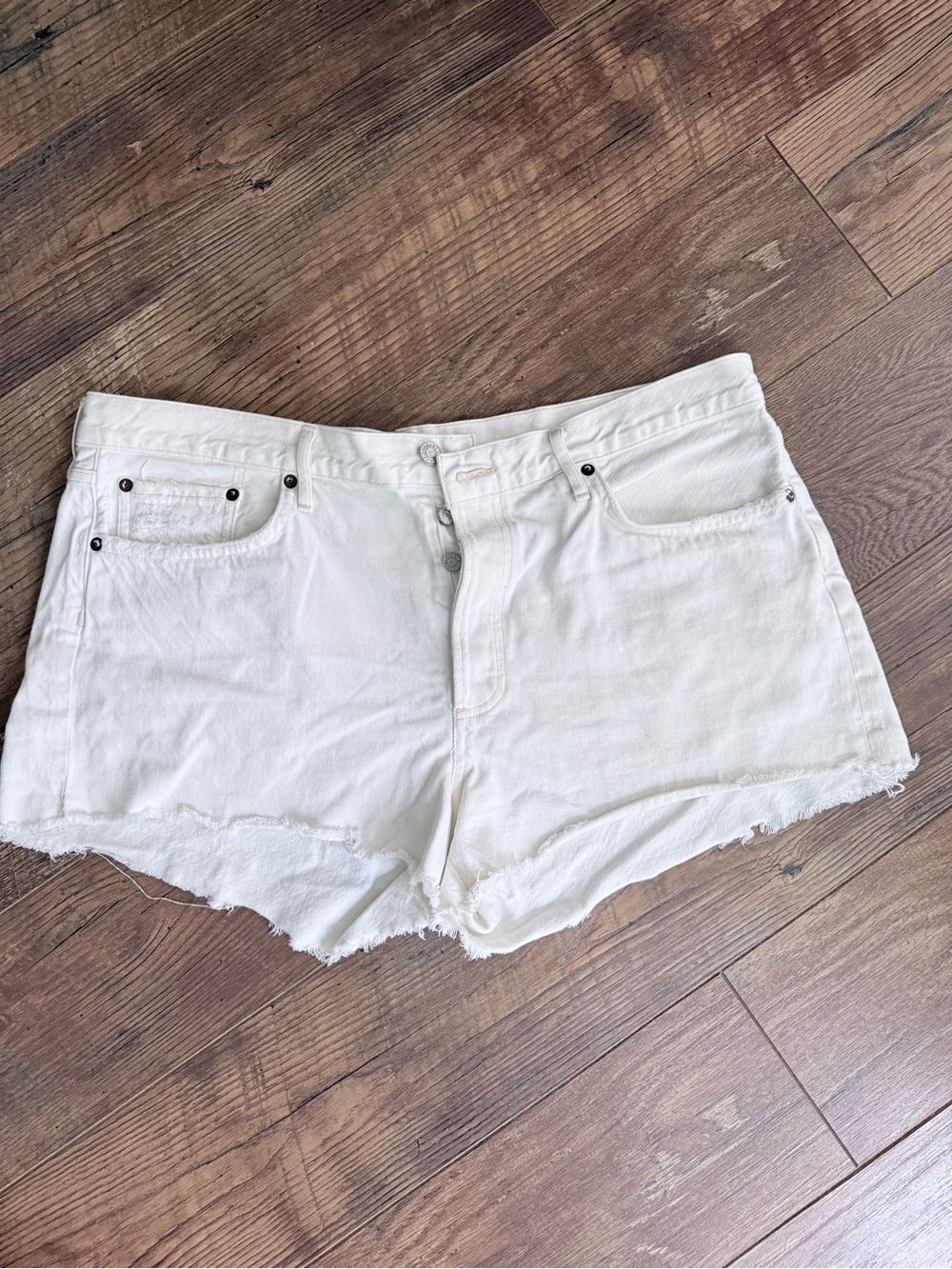 Agolde “Parker” White Cutoff Denim Shorts with Raw Edge